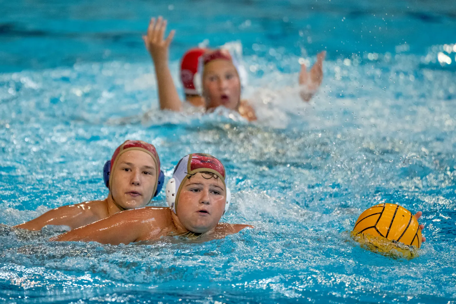 Two young players smiling in the pool